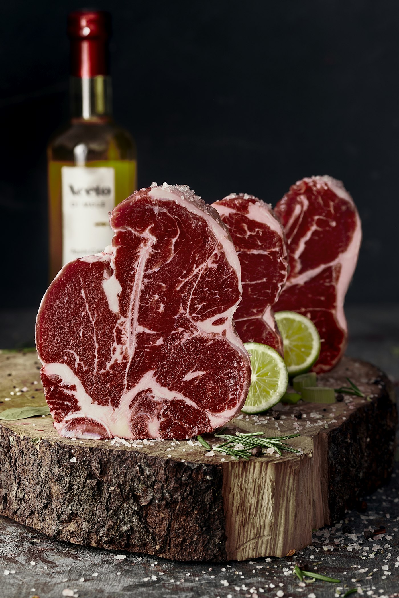 A fresh raw lamb chop on a board